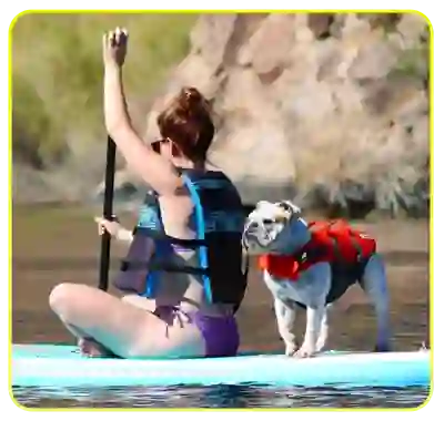 Paddleboard paddler with her faithful dog