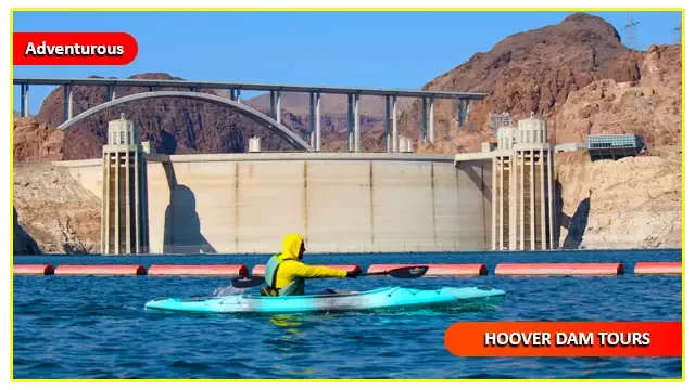 Solo kayaker paddling near the iconic Hoover Dam on the Colorado River during a guided kayaking tour, surrounded by stunning desert cliffs and crystal-blue waters in the Black Canyon.