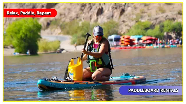 Paddleboarder enjoying a relaxing stand-up paddleboard rental on the calm, clear waters of Willow Beach, surrounded by scenic canyon cliffs and perfect for beginners exploring the Colorado River.