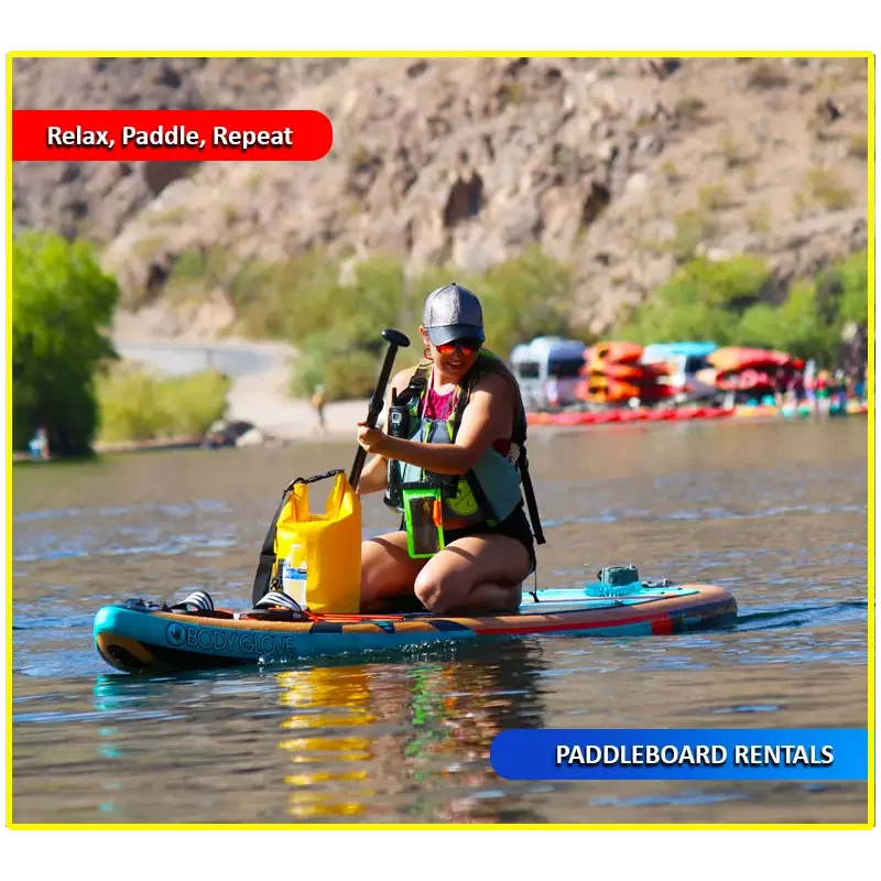 Paddleboarder enjoying a relaxing stand-up paddleboard rental on the calm, clear waters of Willow Beach, surrounded by scenic canyon cliffs and perfect for beginners exploring the Colorado River.